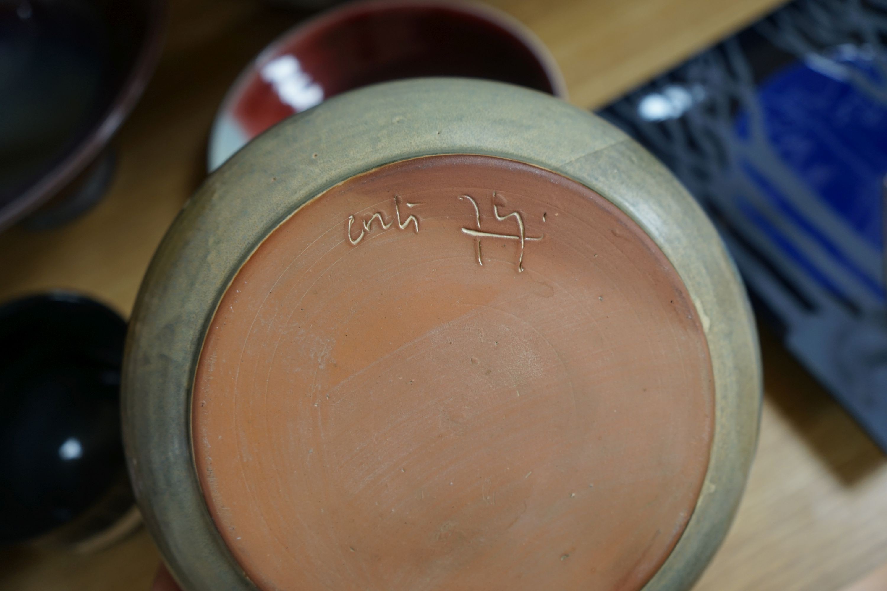 A group of studio pottery vases and dishes to include- 35cm